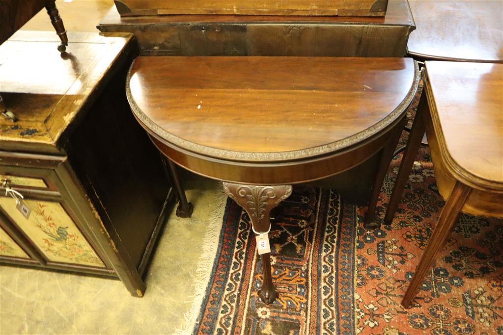 An early 20th century mahogany folding demi lune card table, width 83cm, depth 42cm, height 75cm,